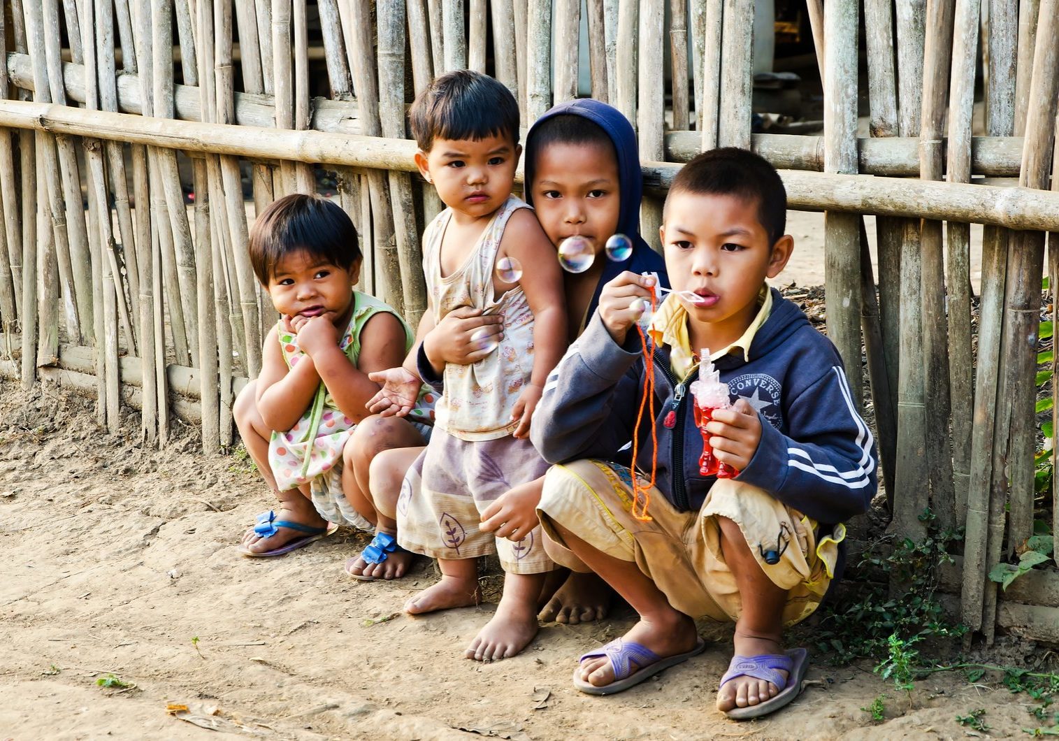 KANCHANABURI THAILAND-January 29: An unidentified Mon children 5-12 years old playing with bubbles on January 29 2012 at KANCHANABURI THAILAND. Mon are an ethnic group spread in Thailand.