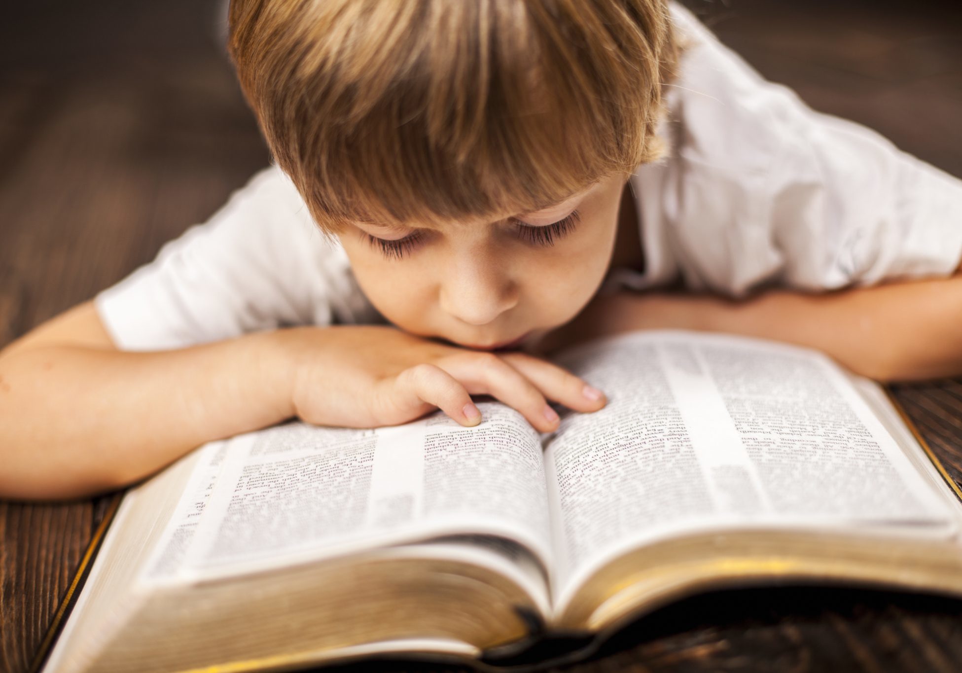 bigstock-little-boy-studying-the-script-80780252